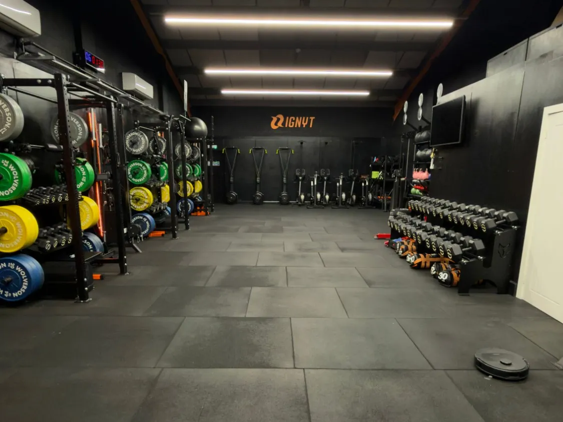 The gym floor at IGNYT Fitness, Haverhill: racks and plates, dumbbells and the coached training area